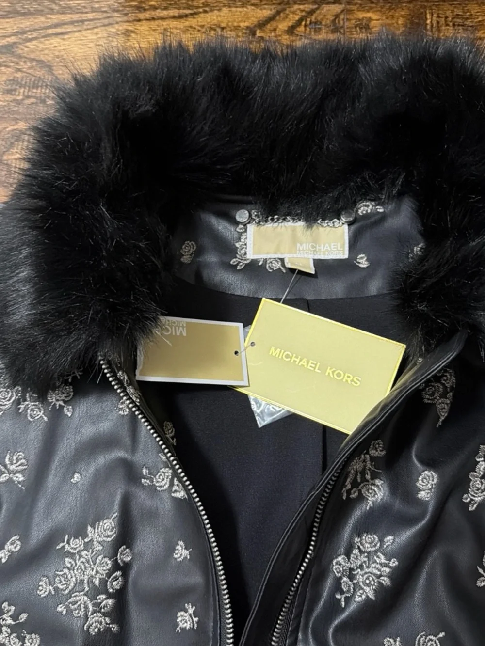 Michael Kors Black Bomber Jacket with Silver Floral Print and Faux Fur Collar